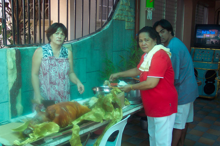 My Ate and my Dite preparing lichon during New Year Reunion
