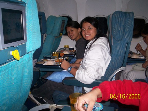 Inside KU airplane, eating dinner
