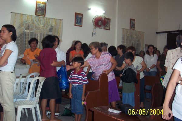 Inang Babang Luksa
Cabrera Family prepare and distribute a package of food distributed to all ka-barangays in Sibacan. At 6pm mass started dedicated to Inang for her Babaang Luksa. My sister Vilma distribute the item souvenir (floral scented candle) for all people attending mass ceremony as photo shown 
